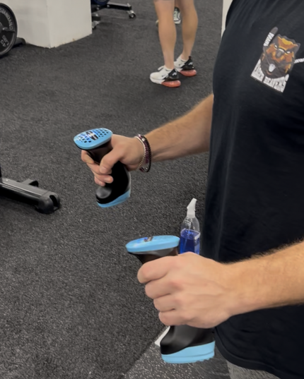 Person in gym using Kuhlers to cools down between sets.